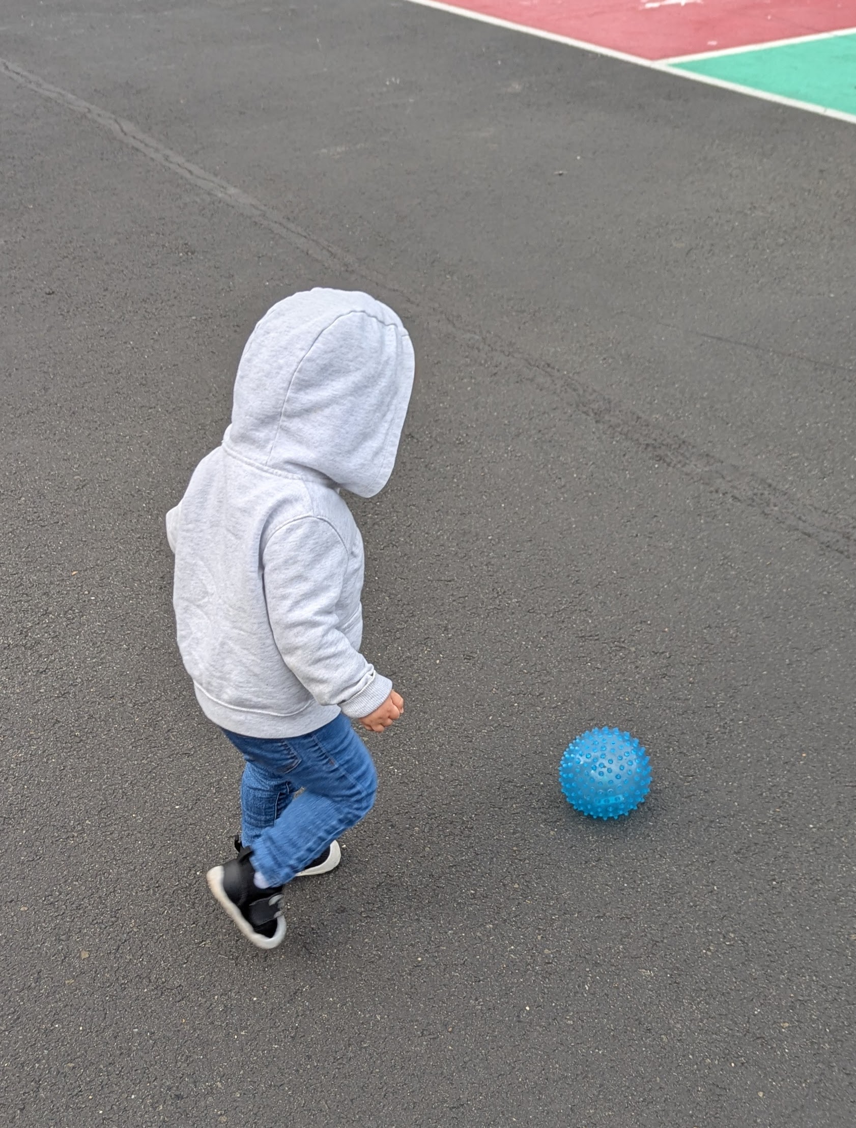 My daughter kicking a ball